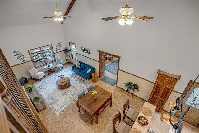 living room featuring high vaulted ceiling and ceiling fan