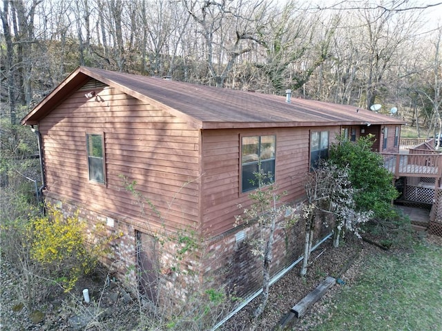 view of side of property with a deck