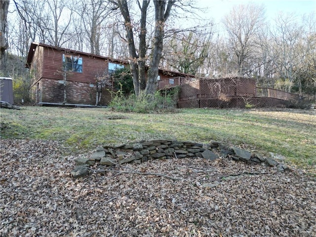 view of yard with a wooden deck