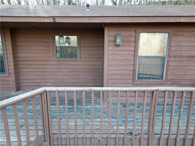 exterior space with roof with shingles