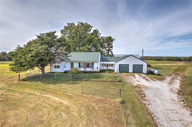 ranch-style home featuring a front lawn and a garage