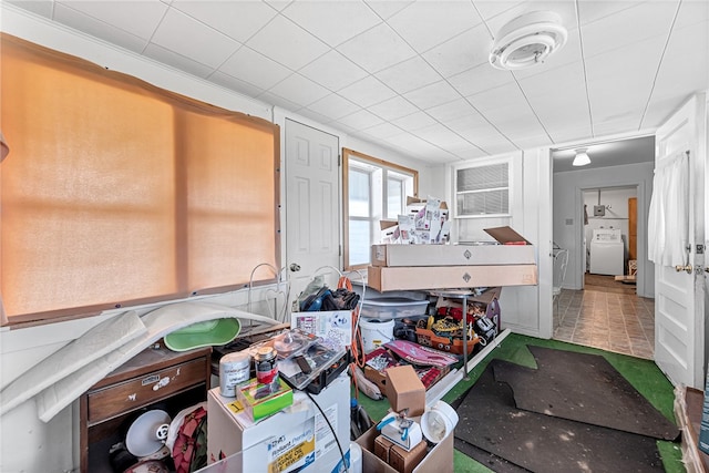 miscellaneous room featuring washer / dryer and tile flooring