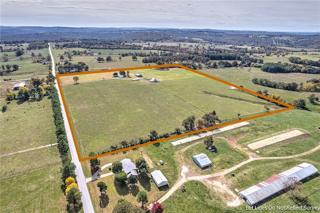 birds eye view of property with a rural view