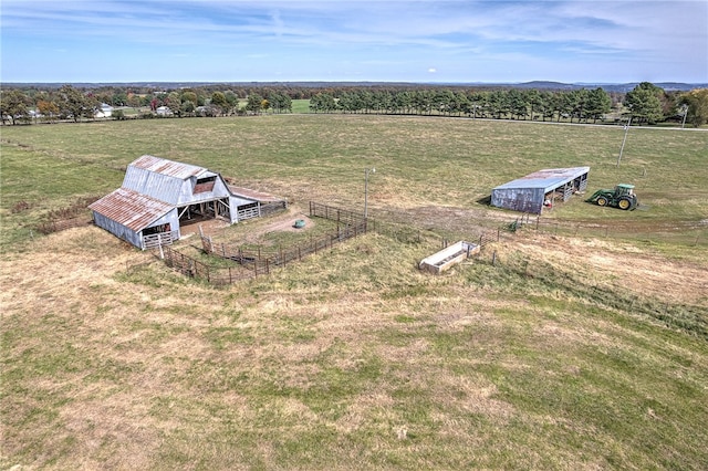 birds eye view of property with a rural view