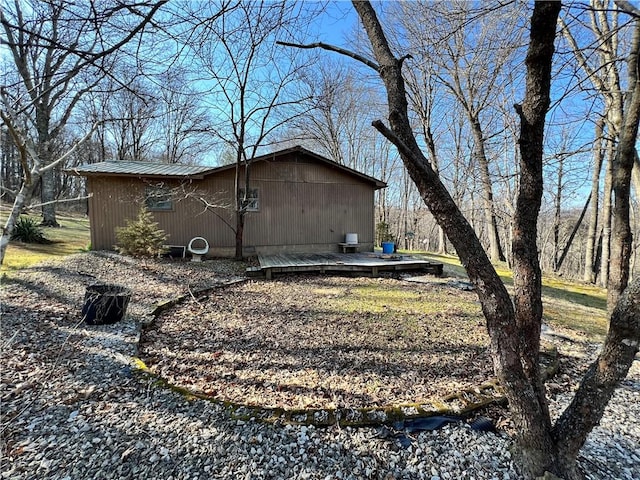 view of side of property featuring a deck