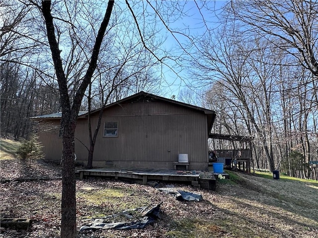 view of side of home with a deck