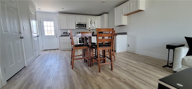 dining room featuring light hardwood / wood-style flooring