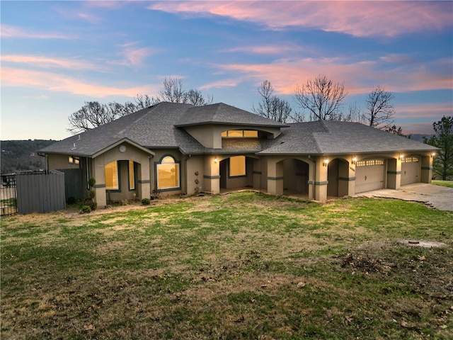 view of front of house with a lawn and a garage