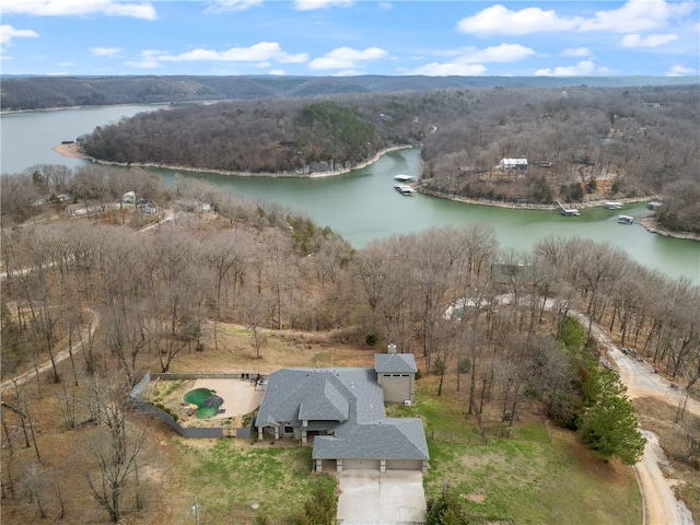 birds eye view of property with a water view