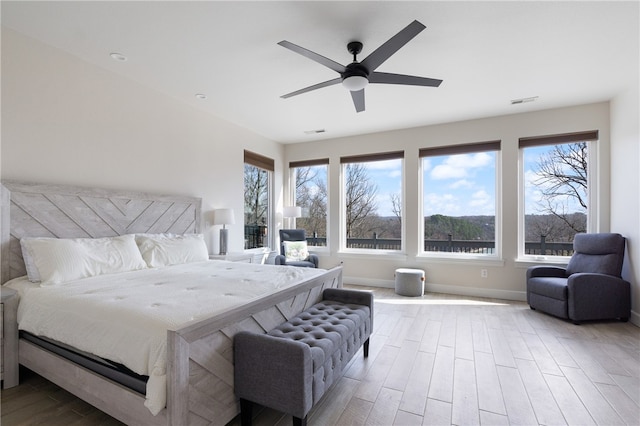 bedroom featuring ceiling fan and light wood-type flooring