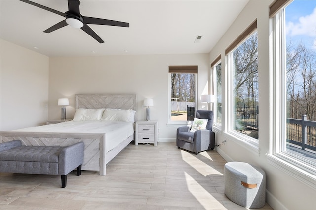 bedroom featuring ceiling fan and light wood-type flooring