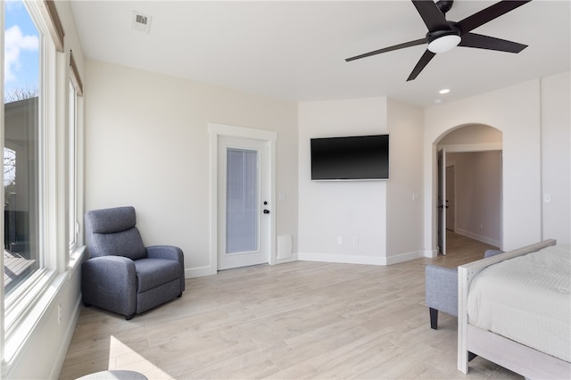 bedroom with light hardwood / wood-style floors and ceiling fan