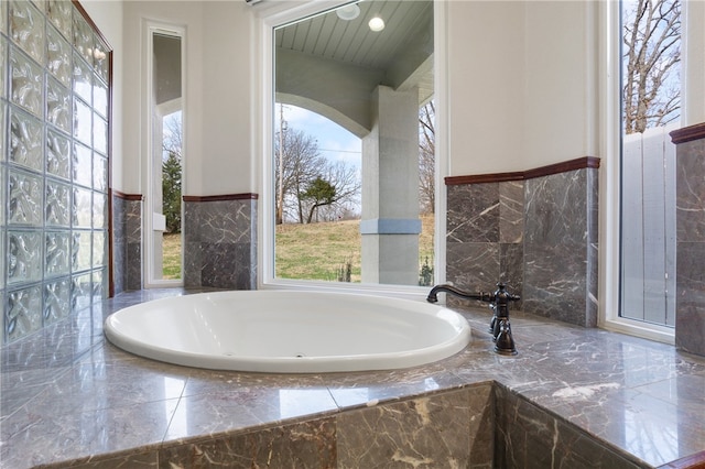 bathroom featuring tiled bath