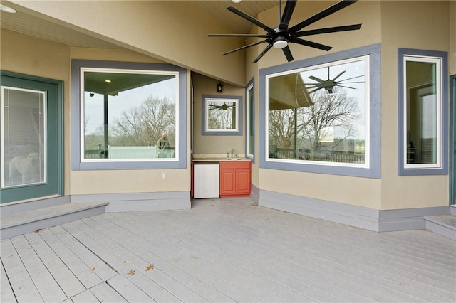 exterior space featuring ceiling fan and sink