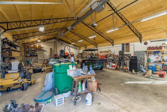 1374 Javello Rd, Tontitown, AR 72762 - garage with a workshop area and a garage door opener