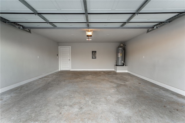 garage featuring a garage door opener and water heater