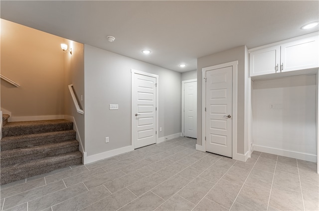 unfurnished bedroom with light tile floors