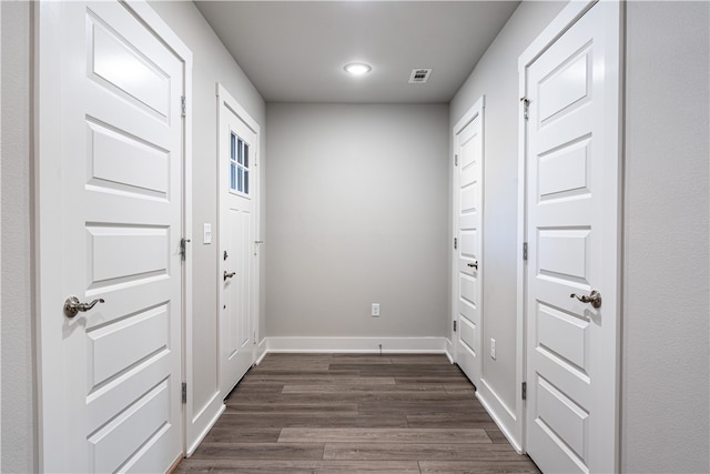 doorway with dark hardwood / wood-style floors