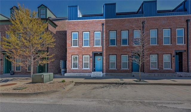 view of front of property featuring brick siding and entry steps