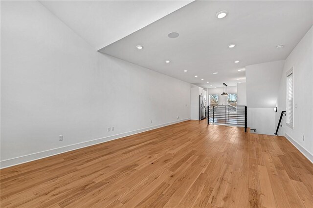 unfurnished living room featuring light wood-type flooring