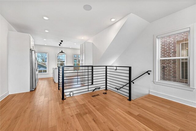 stairs featuring wood-type flooring