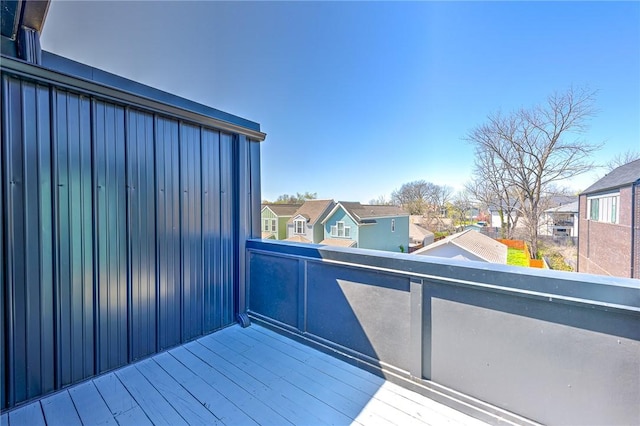 wooden deck with a residential view