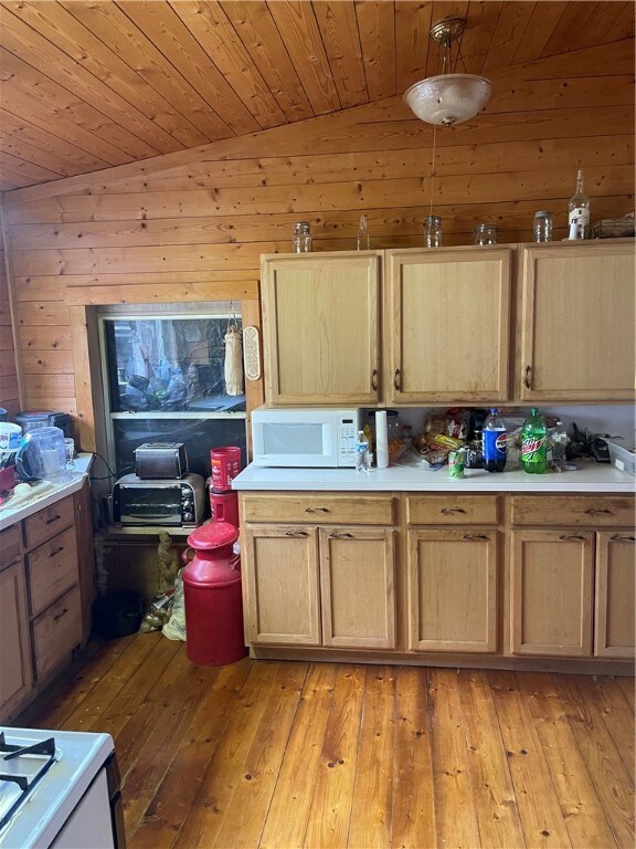 18995 Skylight Mountain Rd, Canehill, AR 72717 - kitchen with light hardwood / wood-style floors, wood ceiling, wooden walls, and lofted ceiling