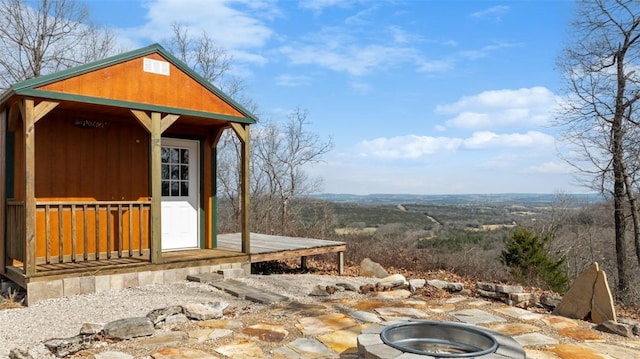 view of patio / terrace featuring an outdoor fire pit