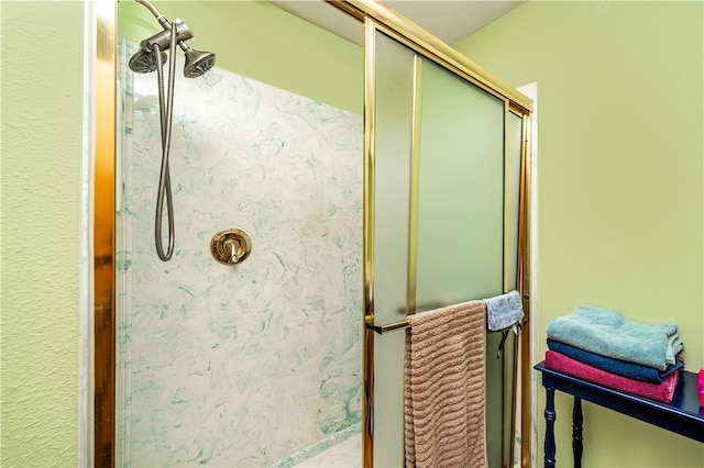 bathroom featuring a shower with door