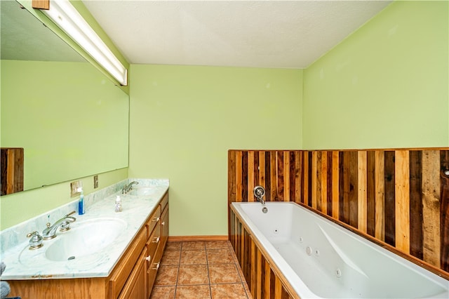 bathroom featuring a bathtub, tile flooring, double sink, and oversized vanity