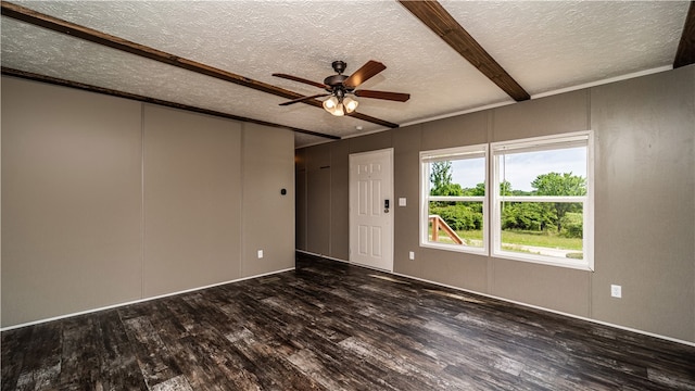 spare room with a textured ceiling, ceiling fan, and dark hardwood / wood-style flooring