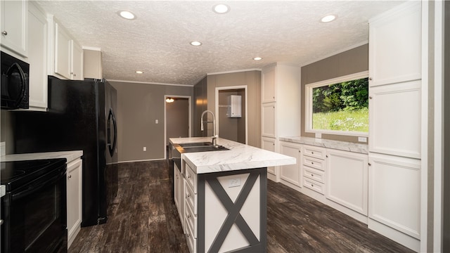 kitchen featuring white cabinets, black appliances, a kitchen island with sink, and dark hardwood / wood-style floors