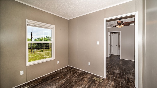 unfurnished room with a textured ceiling, ceiling fan, and dark hardwood / wood-style floors