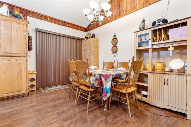 dining room with a notable chandelier and dark wood-type flooring