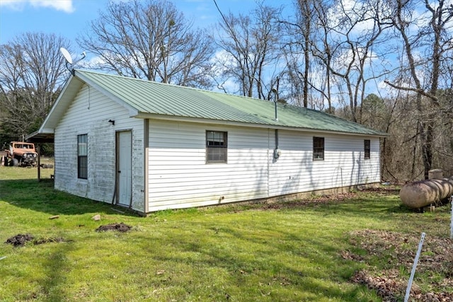 view of home's exterior with a lawn