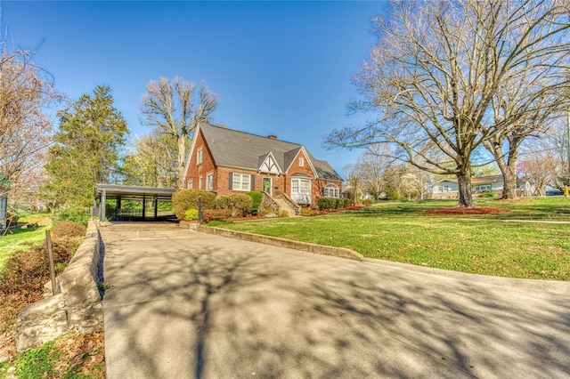 view of front facade featuring a front lawn and a carport