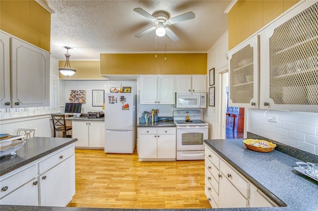 kitchen with light hardwood / wood-style flooring, ceiling fan, white appliances, and white cabinetry