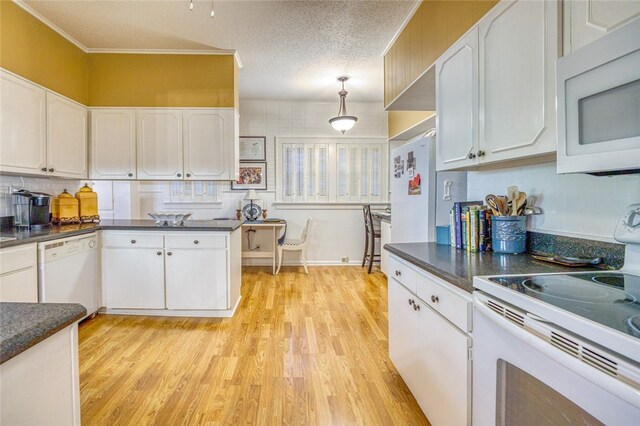 kitchen featuring decorative light fixtures, light hardwood / wood-style floors, white cabinets, a textured ceiling, and white appliances