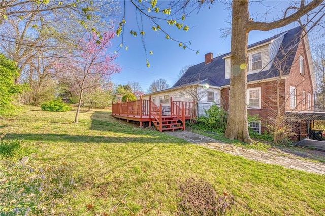 view of yard with a wooden deck