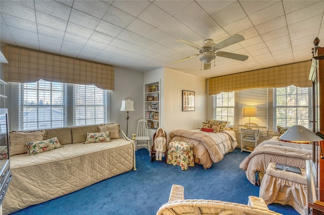 bedroom with ceiling fan and carpet