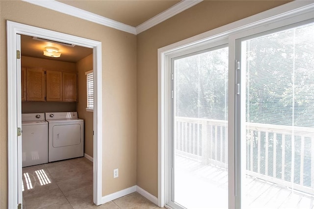 2449 Brophy Cir, Fayetteville, AR 72703 - doorway with crown molding, plenty of natural light, light tile floors, and washing machine and dryer