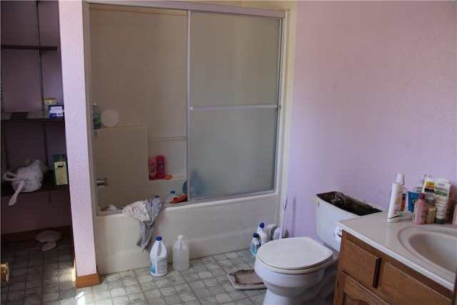 full bathroom featuring toilet, vanity, shower / bath combination with glass door, and tile flooring