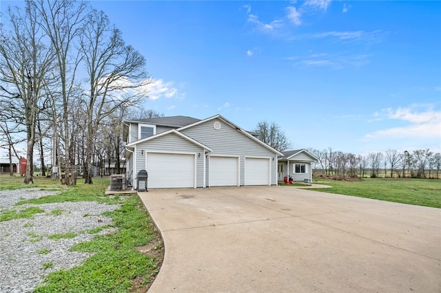 view of home's exterior featuring a garage and a yard