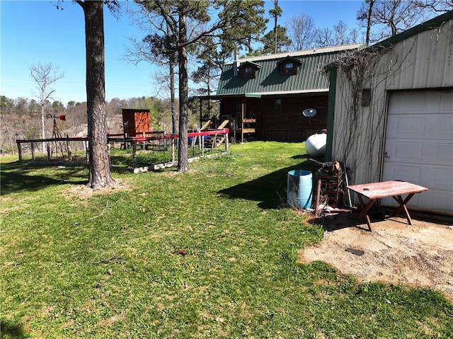 view of yard featuring a garage