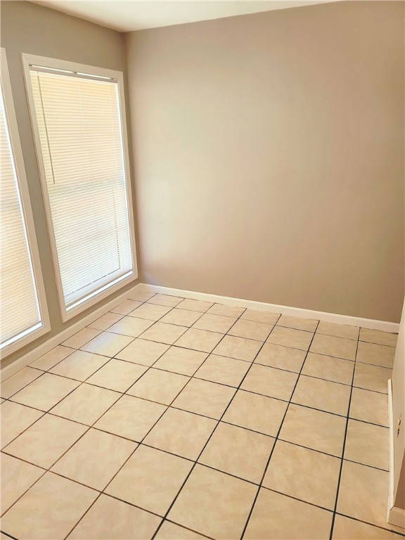 empty room featuring light tile floors