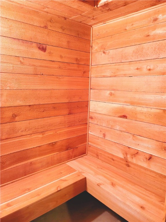 view of sauna / steam room with wooden walls