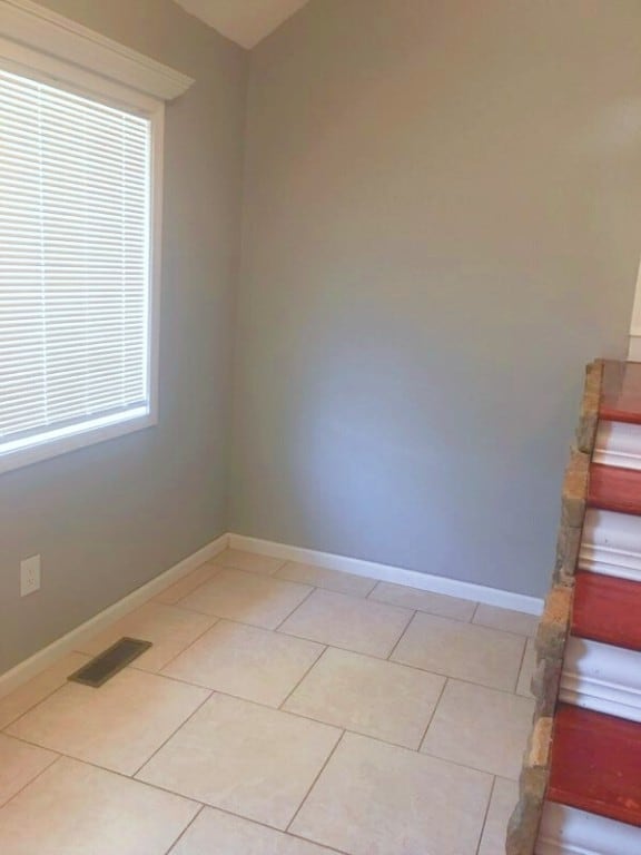 empty room featuring light tile floors