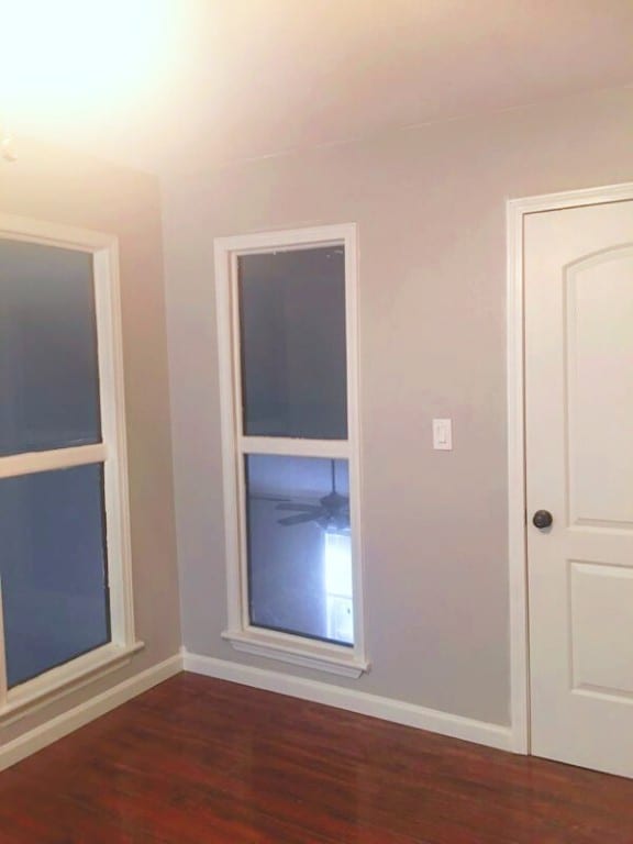 empty room featuring dark hardwood / wood-style floors