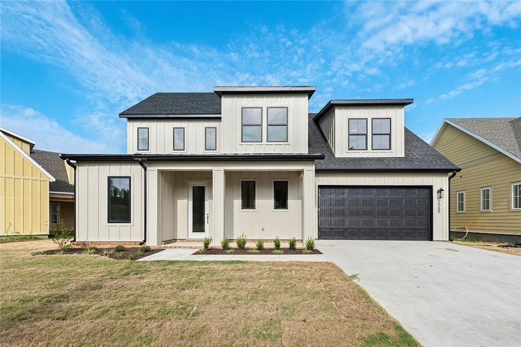 modern farmhouse with a porch and a front yard