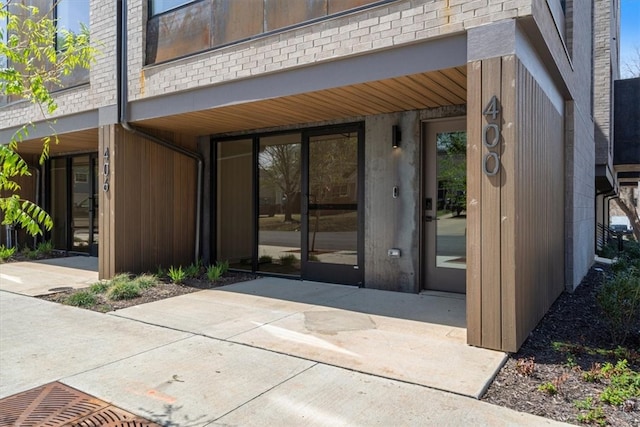 entrance to property with a patio area